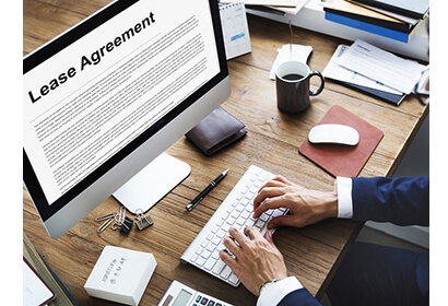 Lease agreement made simple, a man is typing on his computer